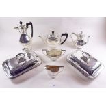 A silver plated four piece tea set, a coffee pot and a pair of silver plated entree dishes