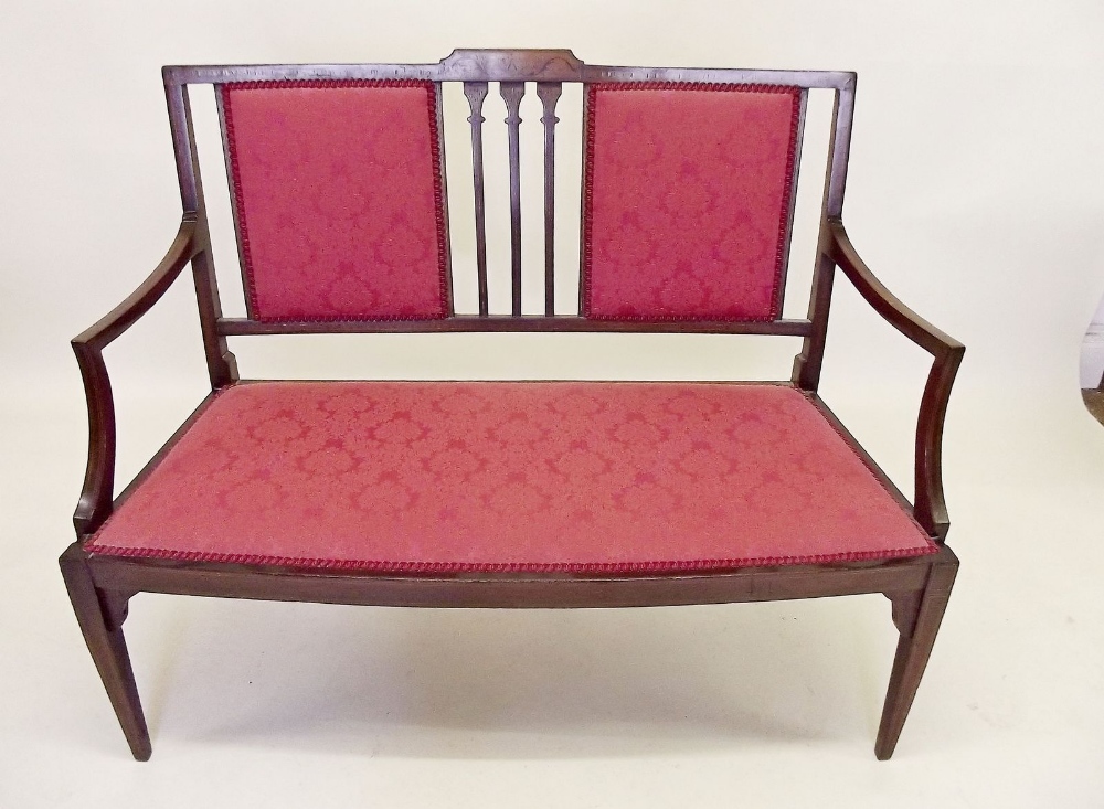 An Edwardian mahogany two seater settee with marquetry decoration