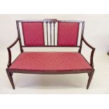 An Edwardian mahogany two seater settee with marquetry decoration
