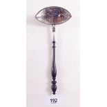 A silver straining ladle with turned wooden handle, Chester 1906 by BM (import hallmarks)