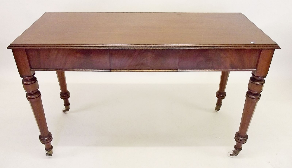 A Victorian mahogany side table with frieze drawer all on turned supports