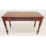 A Victorian mahogany side table with frieze drawer all on turned supports