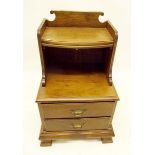 A mahogany bedside cabinet