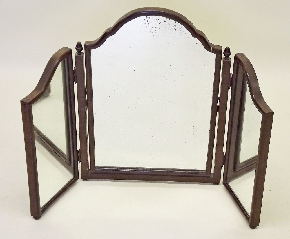 A triple fold mahogany dressing table mirror