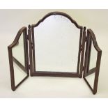 A triple fold mahogany dressing table mirror