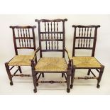 A set of six spindle back dining chairs with rush seats (five diners and one carver)