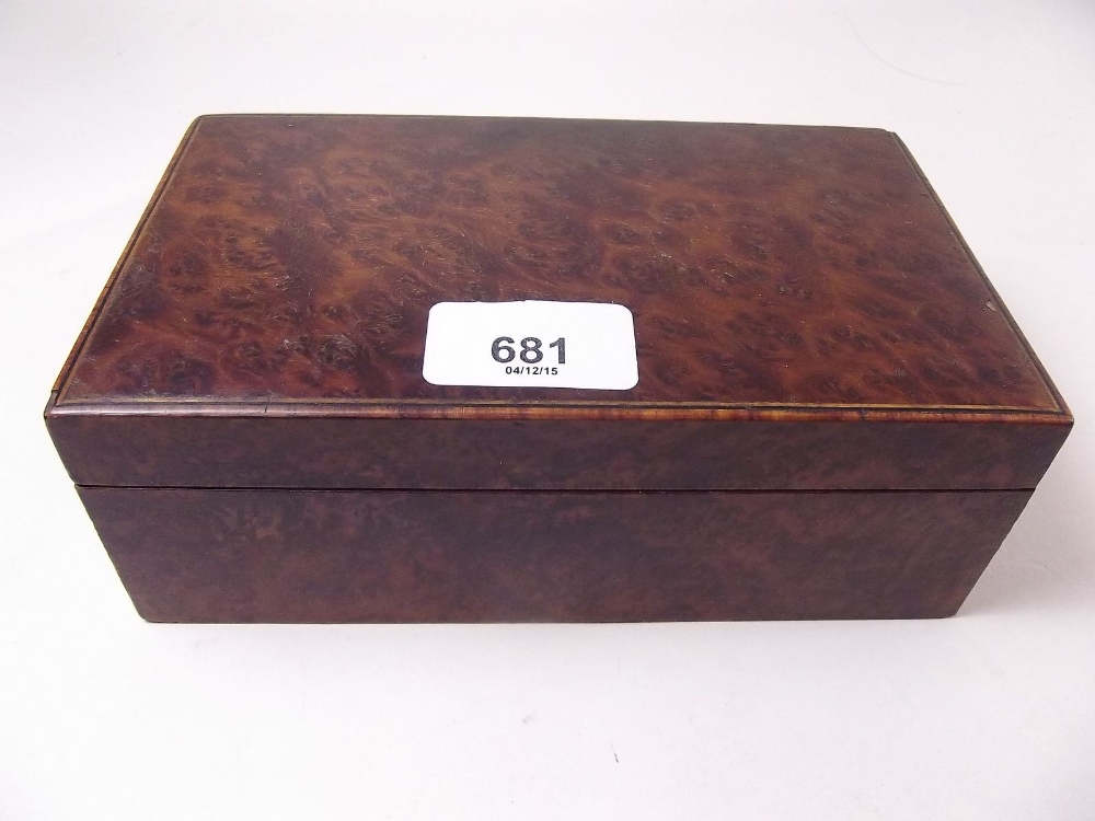 A burr walnut cigarette box with maple interior