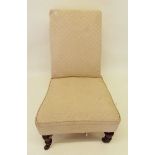 A Victorian nursing chair on turned supports