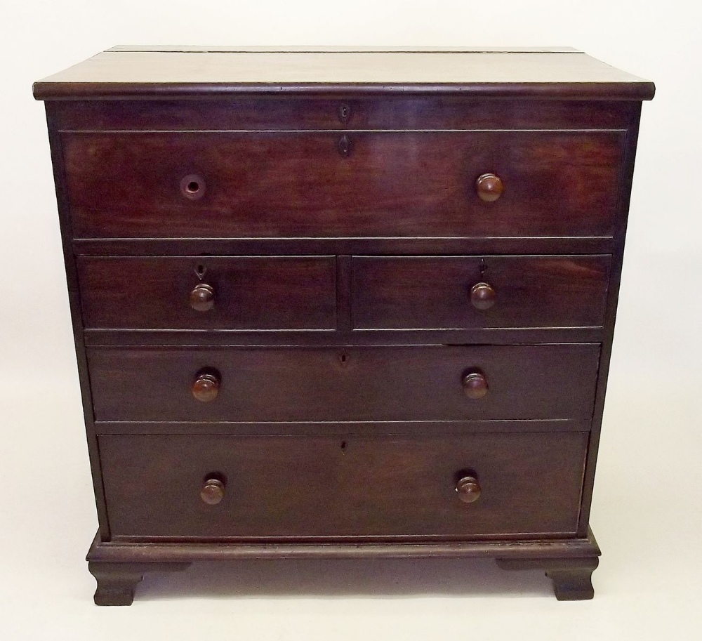 A Victorian mahogany Scotch chest of drawers with rise top over two short and two long drawers