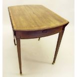 A George III mahogany oval Pembroke table