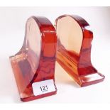 A pair of Art Deco peach glass bookends