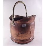 A copper coal scuttle