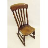 A 19th century rocking nursing chair