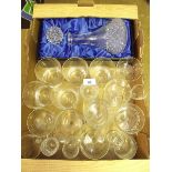 A box of drinking glasses and a decanter