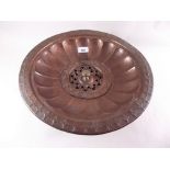 An Indian brass hand washing bowl