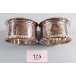 A pair of silver napkin rings with engraved decoration, Birmingham 1911, 95g