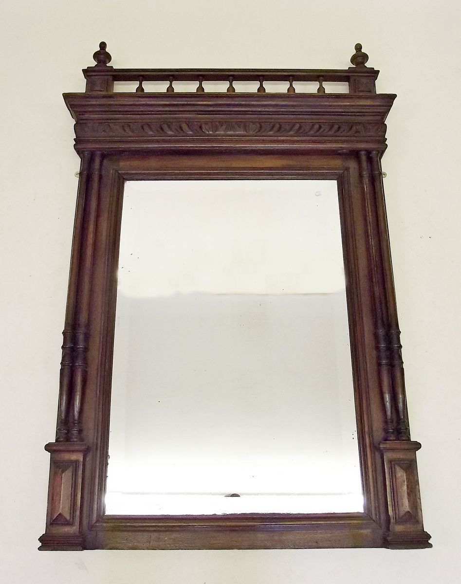 A Victorian spindle topped mirror flanked by twin pillastas 80 x 120cm