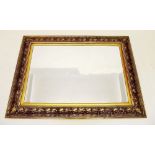 A large foliage moulded gilt framed mirror - 116 x 86cm