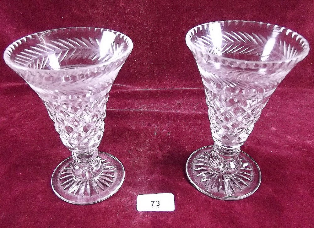 A pair of tapered cut glass vases