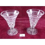 A pair of tapered cut glass vases