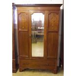 An Edwardian mahogany inlaid single door wardrobe with marquetry inlay