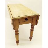 A Victorian pine dropleaf kitchen table