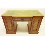 An early 20th century yew twin pedestal desk with later inset leather top