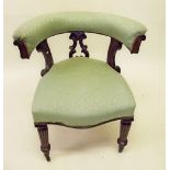 A Victorian mahogany and upholstered bow back chair on turned supports