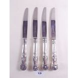 Four silver handled Kings Pattern dinner knives with crests