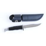 Sheath knife with 4 ins clip point single edged blade stamped Buck 102 USA, steel mounts, black