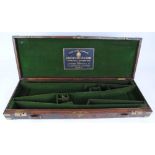 Oak and leather double gun case with brass corners, fitted for 28 ins barrels and with Charles