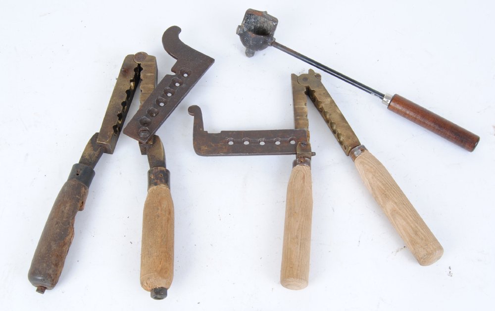 Two large brass bullet moulds, one stamped Willis & Willis 40 and lead ladle