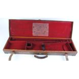 Oak and leather gun case with brass corners, fitted interior for 30 ins barrels and G E Lewis