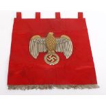 Nazi trumpet banner, heavily embroidered with Eagle over Swastika motif on a red silk ground with