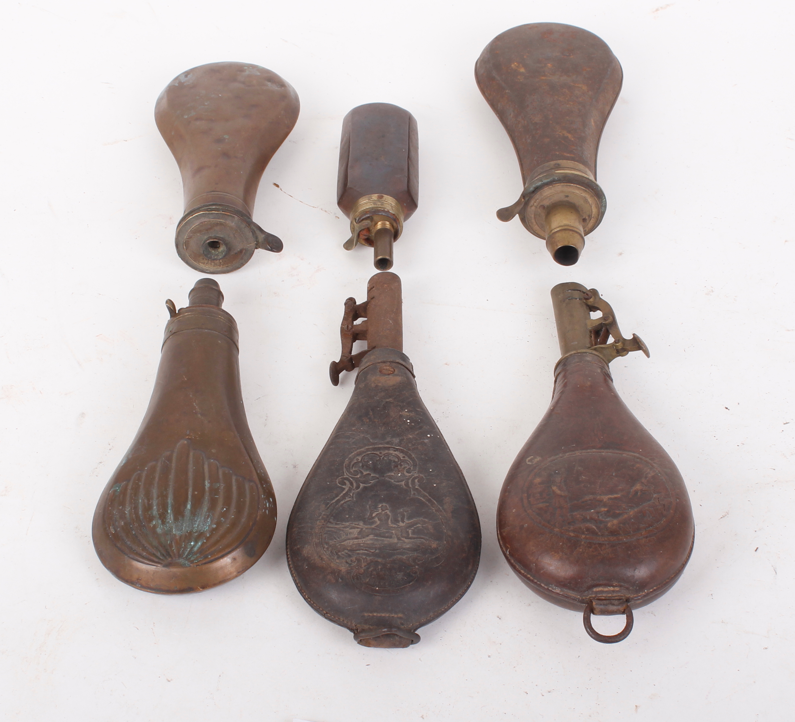 Four copper and brass powder flasks, together with two leather and brass shot flasks