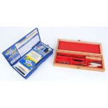 Tetra gun cleaning kit in plastic case and new shotgun cleaning kit in wooden box