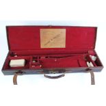 Leather gun case with brass corners, fitted interior for 30 ins barrels and Cogswell & Harrison