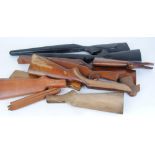 Nine rifle and shotgun stocks, including two Remington Model 700 synthetic stocks