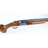 12 bore Fias, over and under, ejector, 30 ins barrels, 3/4 & 1/4, raised ventilated rib, scroll