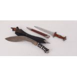 Presentation Kukri in metal mounted leather covered scabbard with two skinning knives, together with