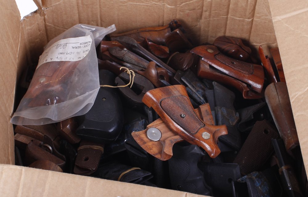 Two boxes containing a large quantity of pistol grips
