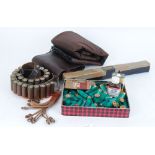 Two gun slips, leather catridge belt and game carrier, cleaning kit and small quantity 12 bore