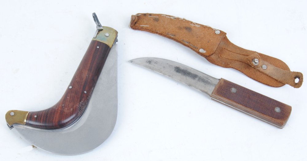 Small hunting knife with leather sheath and clasp knife with curved blade