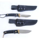 Two Schrade PH 1, knives with 3,1/2 ins single edge blades, brass mounts and studs, composite