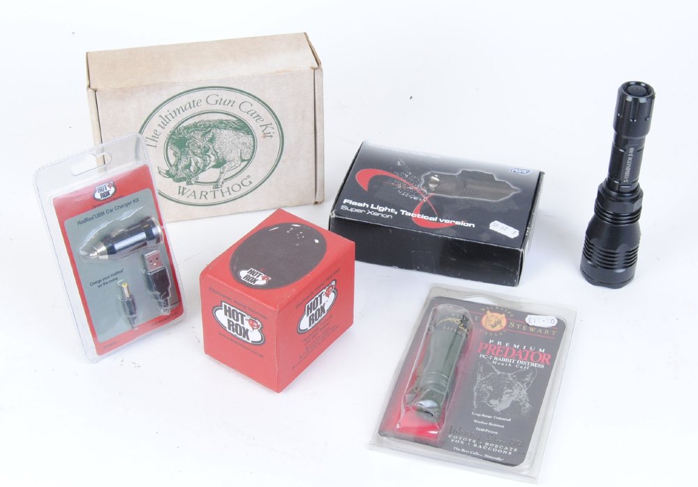 Warthog guncare kit, tactical flashlight (a/f) handwarmer, flashlight, rabbit call, etc.