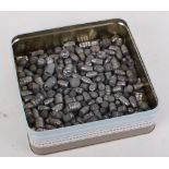 Tin containing quantity lead bullet heads and balls