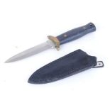 Boot knife with 4 ins double edged blade, brass crossguard, spring clip sheath