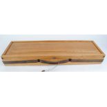 Modern oak gun case by Hunters International, Denmark with adjustable internal compartments for