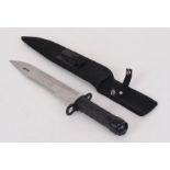 Survival knife with 10 ins single edged serrated back blade, rubber grips, nylon sheath with