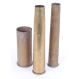 Three brass shell cases, marked MM Mk 4 1956 with broad arrow; No.9 Mk.2 Cart Elec Eng and one